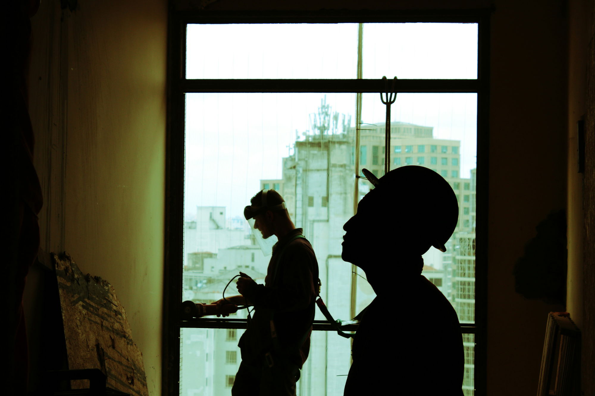 two-men-wearing-hard-hat-standing-near-clear-glass-window.jpg two men wearing hard hat standing near clear glass window