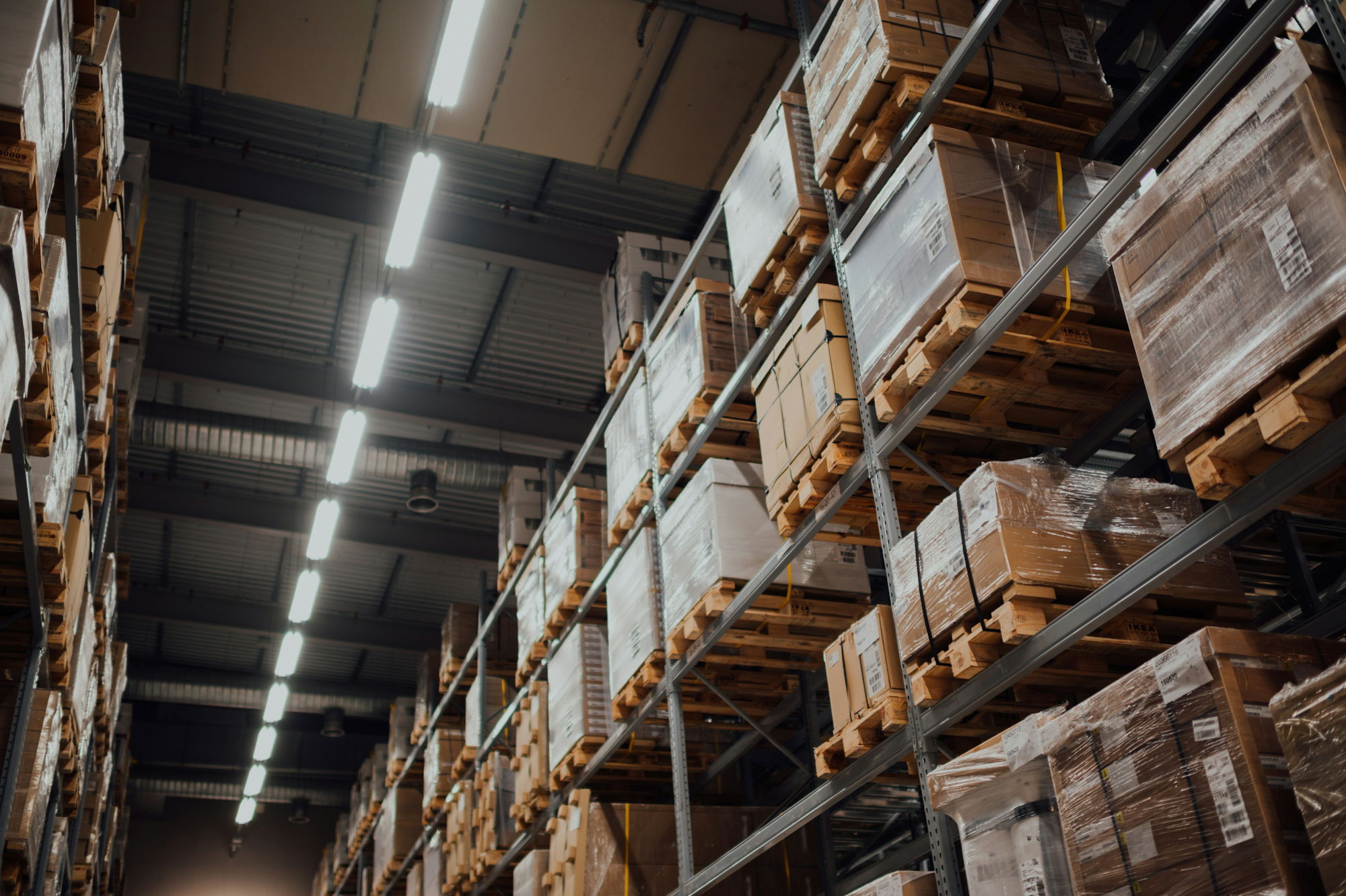 brown-cardboard-boxes-on-white-metal-rack.jpg brown cardboard boxes on white metal rack